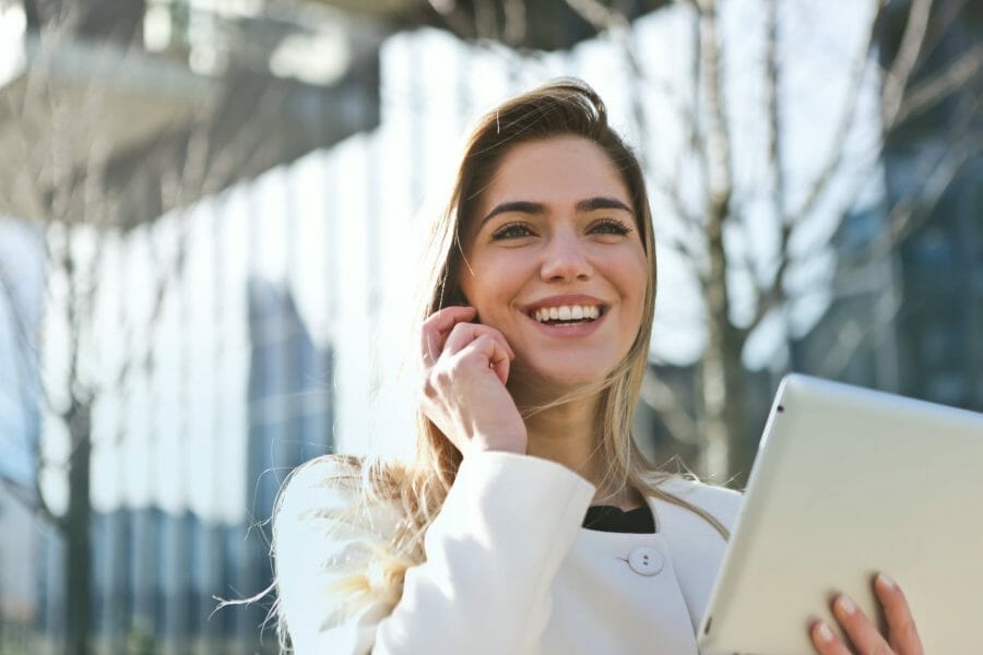 Woman holding computer celebrating Jim2 mps connector to fuji xerox