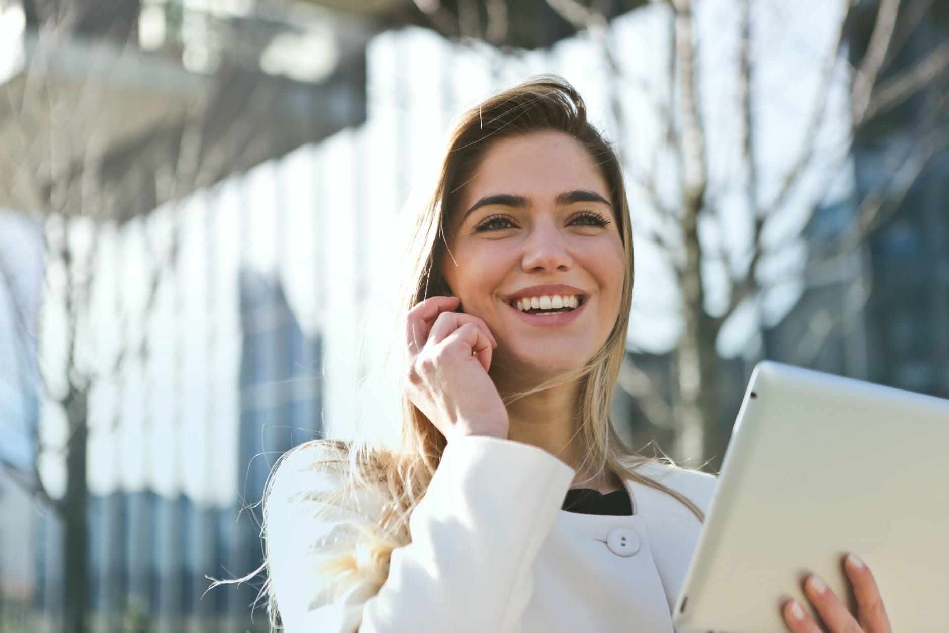 Woman holding computer celebrating Jim2 mps connector to fuji xerox