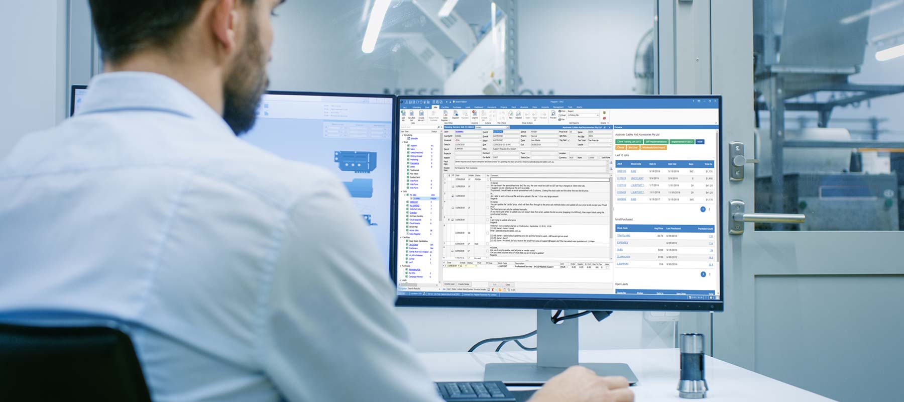 Jim2 ERP Software on premises or cloud based man working at desk duel monitor