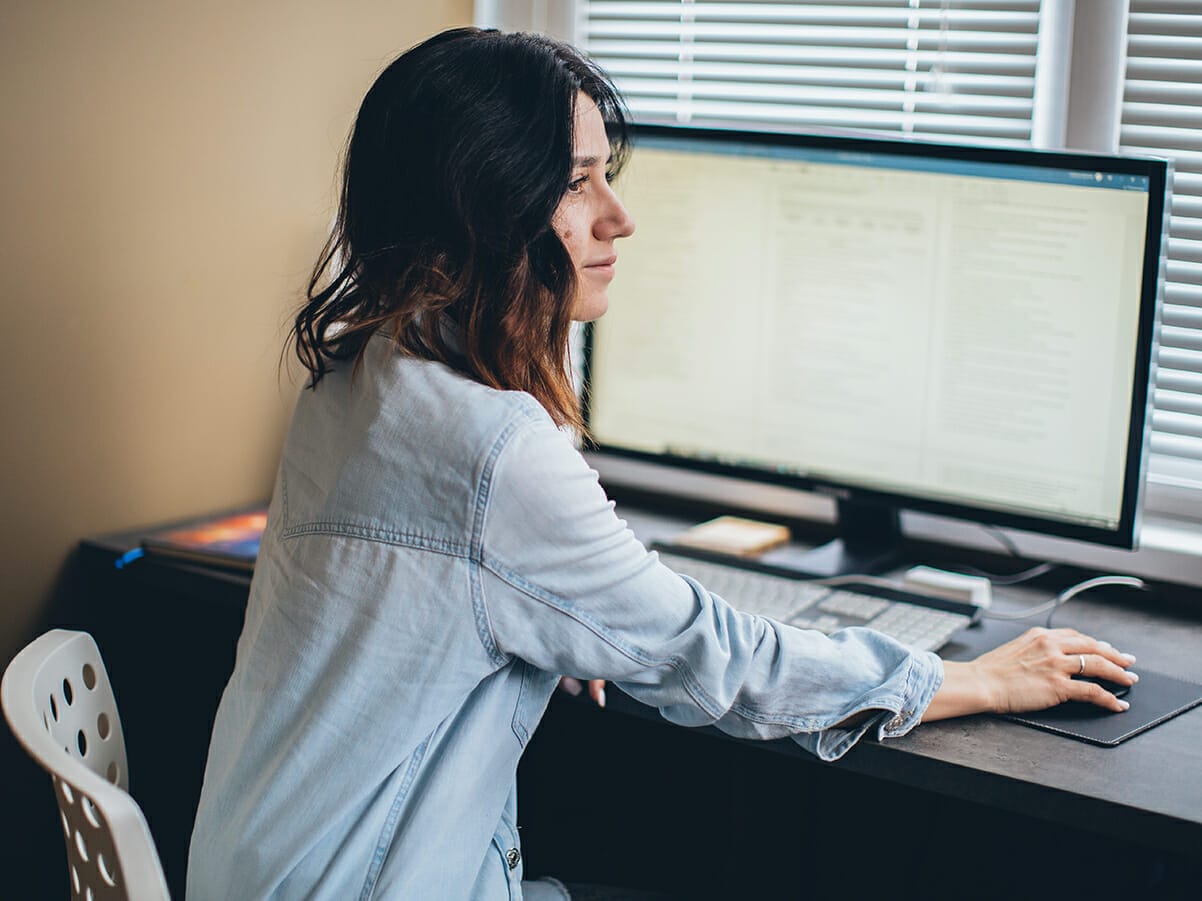 Enterprise Resource Planning Software Jim2 Computer woman using software at desk